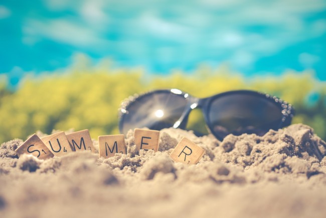 macro-photography-of-black-sunglasses-on-sand-1209610.jpg
